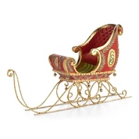 This hand painted sleigh features gold leaf runners and tiny jingle bells to announce the arrival of Santa and his team.