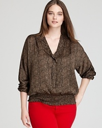 Luxe leopard print lends a touch of glamour to a feminine MICHAEL Michael Kors Plus blouse featuring a chic tie collar.