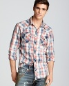 True Religion crafts a super-cool western shirt in a traditional plaid for classic appeal, the perfect complement to a pair of rugged blue jeans.