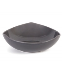 Inspired by an iconic Nambe design, this sculptural vegetable bowl features three gentle points in sleek, sturdy stoneware with a smoke-colored glaze. An essential part of the Tri-Corner dinnerware collection.