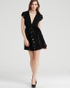 This Mark + James cap-sleeve dress boasts a seriously charming silhouette finished with a sparkling sequin-adorned skirt.