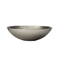 Organically molded under fire, this handmade bowl exudes metal artistry with a New York edge.