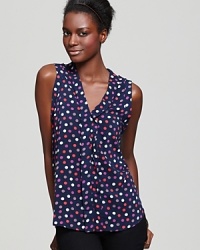 A retro-inspired dash of dots energize this layer-perfect tank with a touch of whimsy.