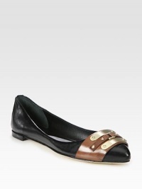 Leather flat with contrast trim and goldtone plating. Leather upperLeather lining and solePadded insoleImportedOUR FIT MODEL RECOMMENDS ordering one half size down as this style runs large. 