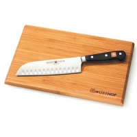 Wusthof 7-in. Classic Hollow Edge Santoku Knife with Bamboo Board.