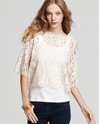 Embrace the lace--this beautiful, lightweight top with lace overlay looks great over a clean white cami or a colorful tank for a fun peek-through contrast.