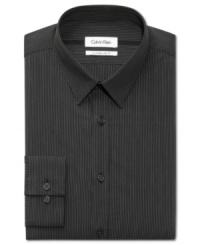 Handsome pinstripes and a flattering fit make this Calvin Klein dress shirt an instant classic.