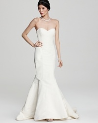 Opt for understated glamour in this Nicole Miller mermaid gown of sweeping silk.