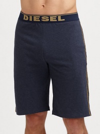 A casual elongated version with logo waistband and contrast piping. Elastic logo waistbandHits above kneeInseam, about 8CottonMachine washImported