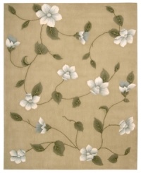 Floral appeal. Gracefully designed with delicate blossoms against a light gold ground, this area rug is hand tufted and hand carved from only the finest premium wool, then expertly washed to lend the surface a handsome luster, texture and sheen.