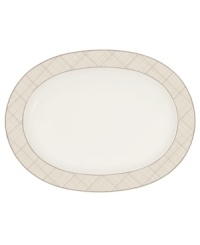 Dressed in a fine diamond grid of bronze and warm taupe, this oval platter is tailored for formal dining and everyday elegance in Noritake bone china. A handsome host for holiday meals or anytime feasts. From Noritake's collection of serveware and serving dishes.