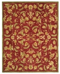 Bold burgundy houses an intricate assortment of intertwined blossoms and vines on this Turkish-inspired area rug from Safavieh. Pure wool is hand-tufted in a thick three-quarter-inch pile, finished with a cotton backing for long-lasting durability.