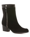 Sleek uppers punched up with bold zippers and trim at the cuffs make these Stuart Weitzman GORE-TEX boots a wet-weather fashion must.