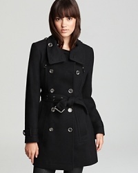 Clean lines and classic tailoring imbue the essential Burberry Brit trench coat with effortless sophistication.