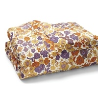 Dress your bed with a signature DIANE von FURSTENBERG bold floral print in shades of gold, orange and purple.