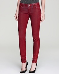 A glossy coat of color lends a leather-like effect to these MICHAEL Michael Kors jeggings, rendered with a hint of stretch for a sleek fit and striking silhouette.