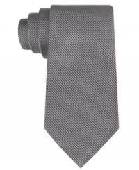 Mix it up with a touch of texture. This slim corduroy tie from Calvin Klein does gives your look a modern twist.