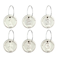 This elegant assortment of weighty ceramic wine charms each feature Juliska's signature thread-and-berry detailing. Numbered one through six, they're finished in a rich, warm white hue with slightly distressed appearance.