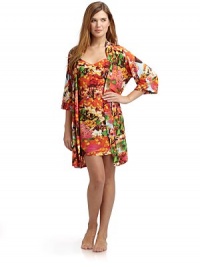 THE LOOKAllover abstract floral printWrap front with cinched drawstring tie closureElbow length sleevesTHE FITAbout 36 from shoulder to hemTHE MATERIALPolyester/spandexCARE & ORIGINMachine washImportedModel shown is 5'10 (177cm) wearing US size Small. 