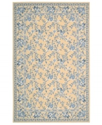 Attractive floral images make this country-style rug a delightful addition to any room. Woven from plush wool, the Country Heritage rug features a muted yellow field, speckled with beautiful blues and whites.