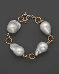 Boldly gleaming baroque freshwater pearls add rich luster to 14K yellow gold. By Nancy B.