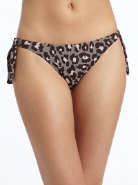 THE LOOKAllover leopard printSide tiesElastic waist and leg openingsTHE MATERIAL80% nylon/20% spandexFully linedCARE & ORIGINHand washMade in USAPlease note: Bikini top sold separately. 