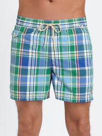 The classic Traveler swim short is rendered in sleek, quick-drying microfiber in a vibrant plaid pattern for cool, casual beach style.Elastic waistband with drawstring tie closureSide slash pocketsBack waist drainage grommetsBack flap patch pocketMesh liningInseam, about 4¾52% cotton/48% nylonMachine washImported