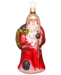 Equipped with his walking stick and heavy boots, this Inge-Glas Santa is ready for a long journey! Mouth-blown and hand-painted, this ornament shines bright every year.