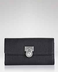 A logo-stamped lock detail adds edgy appeal to this polished leather wallet. By MICHAEL Michael Kors.