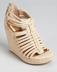 A strappy sandal from Dolce Vita, the Tatiana wedges exude summer style with a raffia heel.