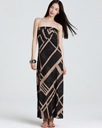 Capitalizing on this season's tribal trend, this DKNYC maxi dress sends your style on a wild ride with an oversized graphic print and a floor-skimming silhouette.