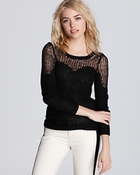 This cozy Free People sweater takes on a sweeter side with the addition of a sheer, contoured sweetheart neckline.