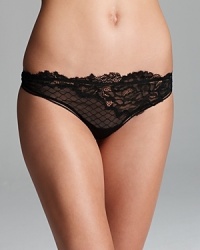 With fishnet mesh and intricate lace work, you'll wish this Calvin Klein Underwear thong came in a dress. Style #F3543.