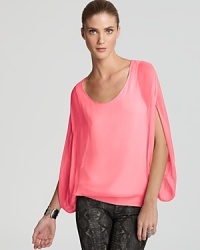 Embrace the elegant ease of this ethereal DIANE von FURSTENBERG top rendered in pure silk.