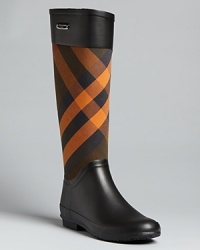 Checkmates: these classically Burberry rain boots give plaid added punch in a cheerful shade of orange.