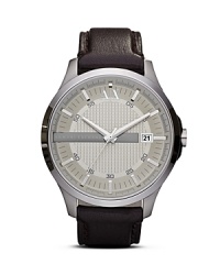 Crafted of sleek stainless steel this watch from Armani Exchange perfects easy-cool. The streamlined design is accented by leather band giving it a functional yet stylish finish.