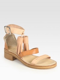 Oversized tassels and modern colorblocking rejuvenate this leather gladiator with a wide, adjustable ankle strap. Stacked heel, 1 (25mm)Leather upperLeather lining and solePadded insoleMade in ItalyOUR FIT MODEL RECOMMENDS ordering true whole size; ½ sizes should order the next whole size down. 