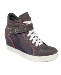 Get ready for the limelight. G by GUESS' Pop Star wedge sneakers feature stud detailing and a Velcro strap across the lace-up vamp.