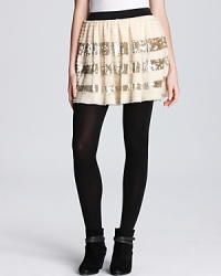 Silver sequined stripes add party-poised pizazz to this festive little Free People skirt.