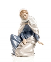 In her simple beauty, Mary peers down adoringly to where baby Jesus lays his head. Recreate the wonder, awe and miracle of Christmas with this delicately handcrafted nativity figurine from Nao by Lladro.