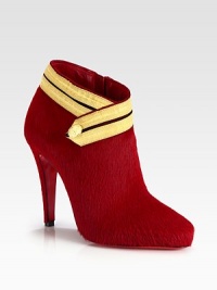 A head-turning raised silhouette of luxe pony hair, topped off with button-detailed ribbon trim. Self-covered heel, 4 (100mm)Pony hair upper with ribbon trimSide zipLeather liningSignature red leather solePadded insoleMade in Italy