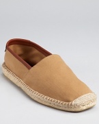 Salvatore Ferragamo bring its signature sophistication to your leisure look. This comfy slip on is crafted in soft cotton, with leather trim and espadrille along the sides and toe.