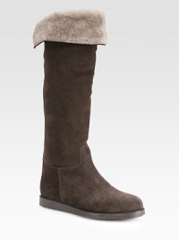 Infused with comfortable shearling lining, this suede knee-high design has grosgrain ribbon trim and a rubber sole. Rubber heel, 1 (25mm)Shaft, 18Leg circumference, 14Suede and grosgrain ribbon upperPull-on styleShearling liningRubber solePadded insoleMade in Italy