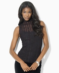 A stretch ribbon lace construction lend a chic and glamorous update to this stunning mockneck top.