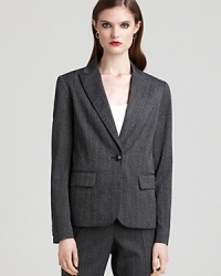 This tweed herringbone jacket from Pippa sets your in style for the office. Boasting a single button closure and buttons at the cuffs, the suit separate features three front pockets.