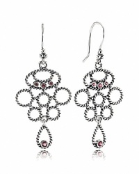 A chandelier silhouette takes on added elegance with sterling silver cables and bezel-set rhodolite stones. Earrings by PANDORA.