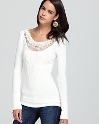 When the urge to add a little bohemian flair to your outfit hits, look no further than Free People. This comfortable thermal knit features a crochet panel on the front that creates a sheer detail right below the collar. Pair it with skinny jeans and ankle boots for a no-fail fall look!