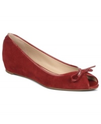 Flounce about in your pretty shoes. The Model flats by Franco Sarto feature a pretty peep-toe and a cute bow at the top.