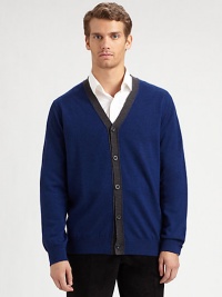 A smart, preppy layer in soft merino wool with an easy button front and striking contrast border.V-neckButton frontLong sleevesMerino woolHand washImported