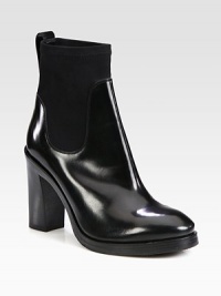 Instantly cool and on-trend, this shiny leather and stretchy neoprene ankle boot is a wardrobe must-have. Stacked heel, 4¼ (110mm)Stacked platform, ½ (15mm)Compares to a 3¾ heel (95mm)Shiny leather and neoprene upperPull-on styleLeather liningRubber solePadded insoleMade in Italy